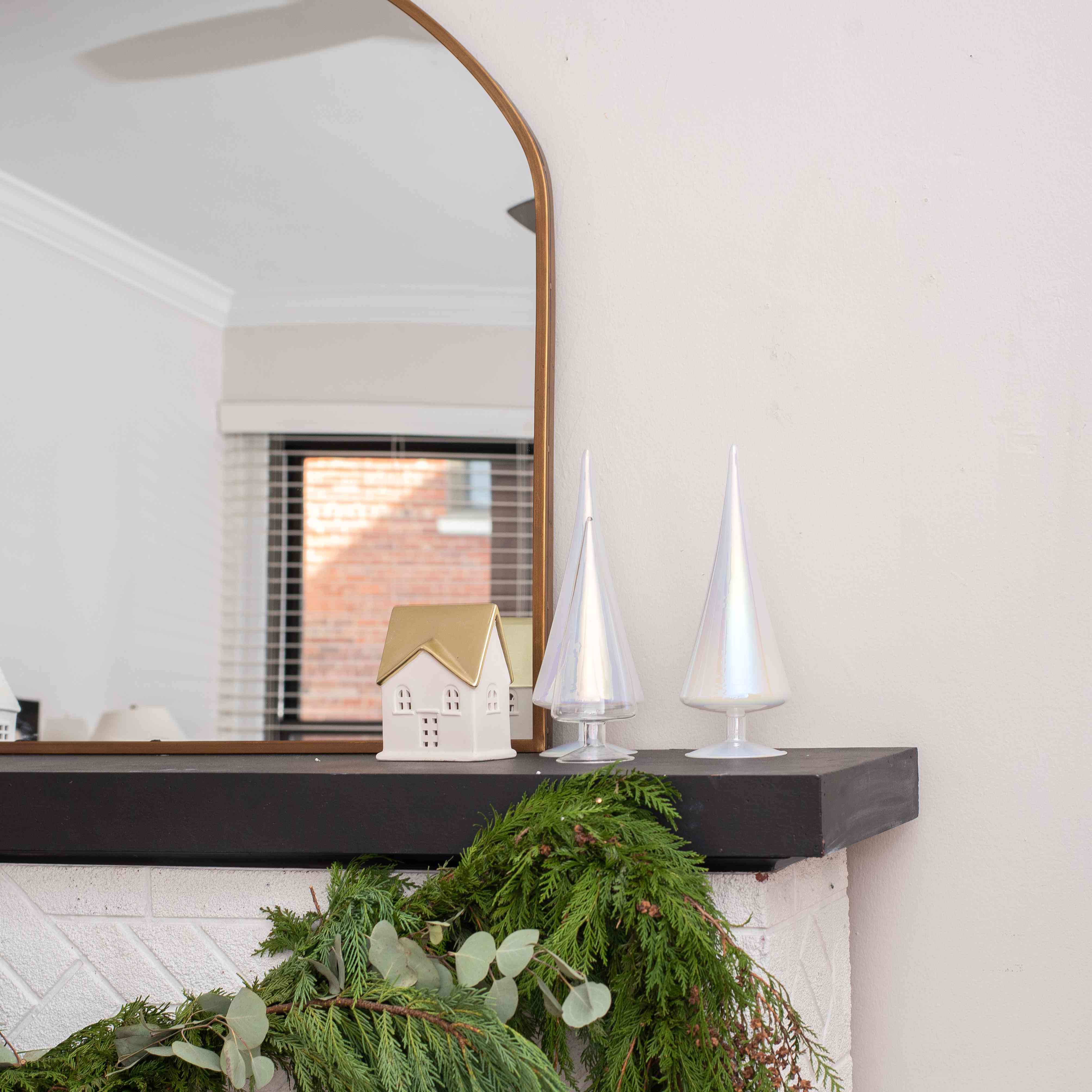 Mantle with fresh garland and eucalyptus.