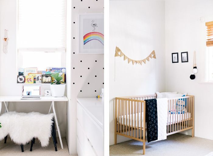 房间的特写镜头左侧和婴儿的简约的木制婴儿床的右侧的迷你办公桌和电脑