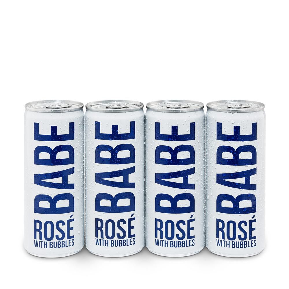 四罐的闪闪发光的玫瑰酒。