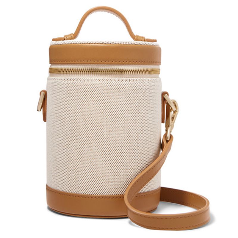 画布和真皮装饰斗形斜挎包。