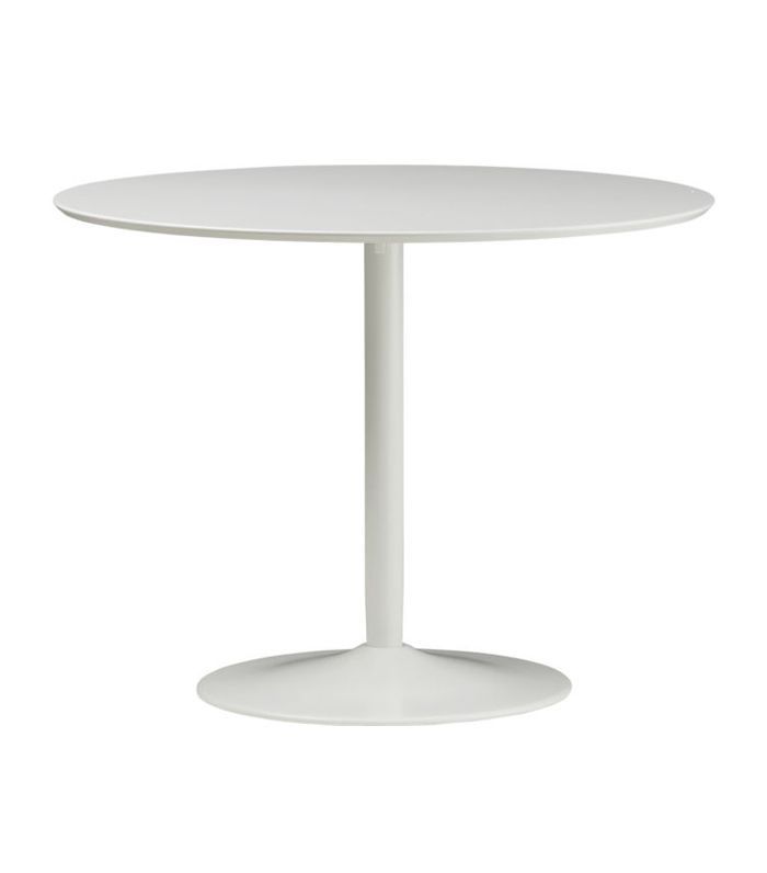 白色郁金香风格的圆形餐桌，由CB2。