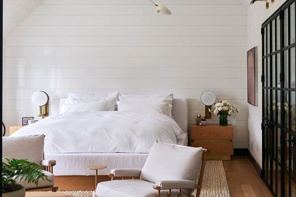 Bedroom with a chair and light fixture