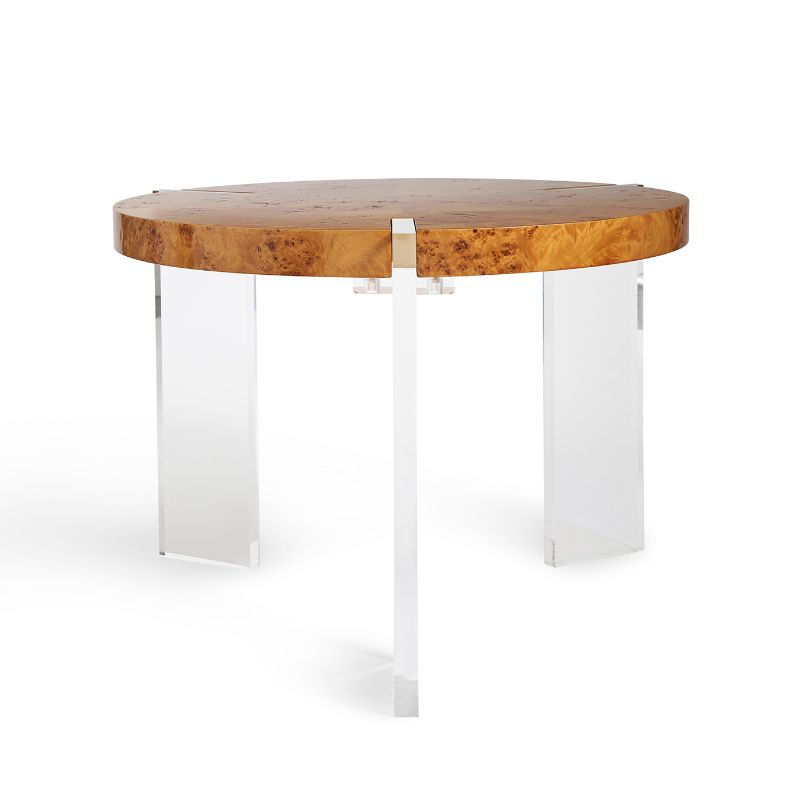 一个圆形的茶几与丙烯酸插图腿和影木顶。