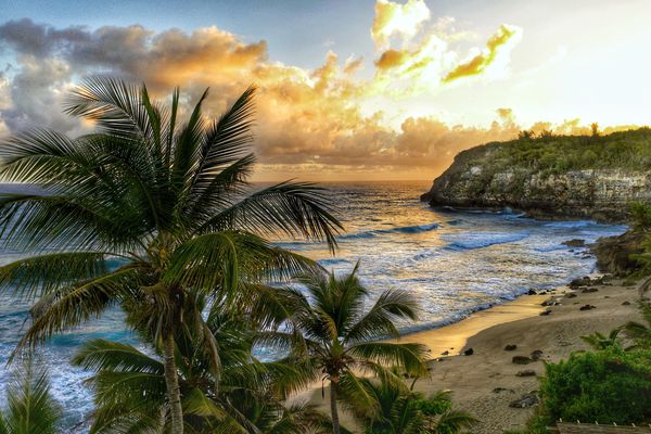 波多黎各海滩上的日落。”class=