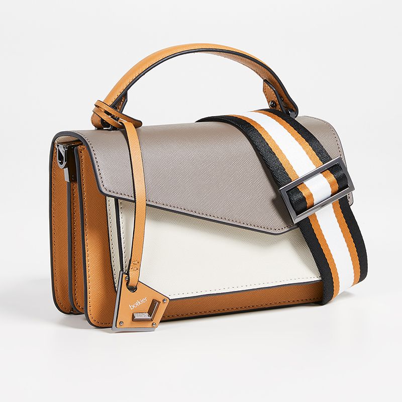 在灰色和黄色一种皮革斜背包阻止色调。