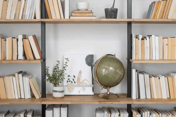 Styled bookshelves with globe.
